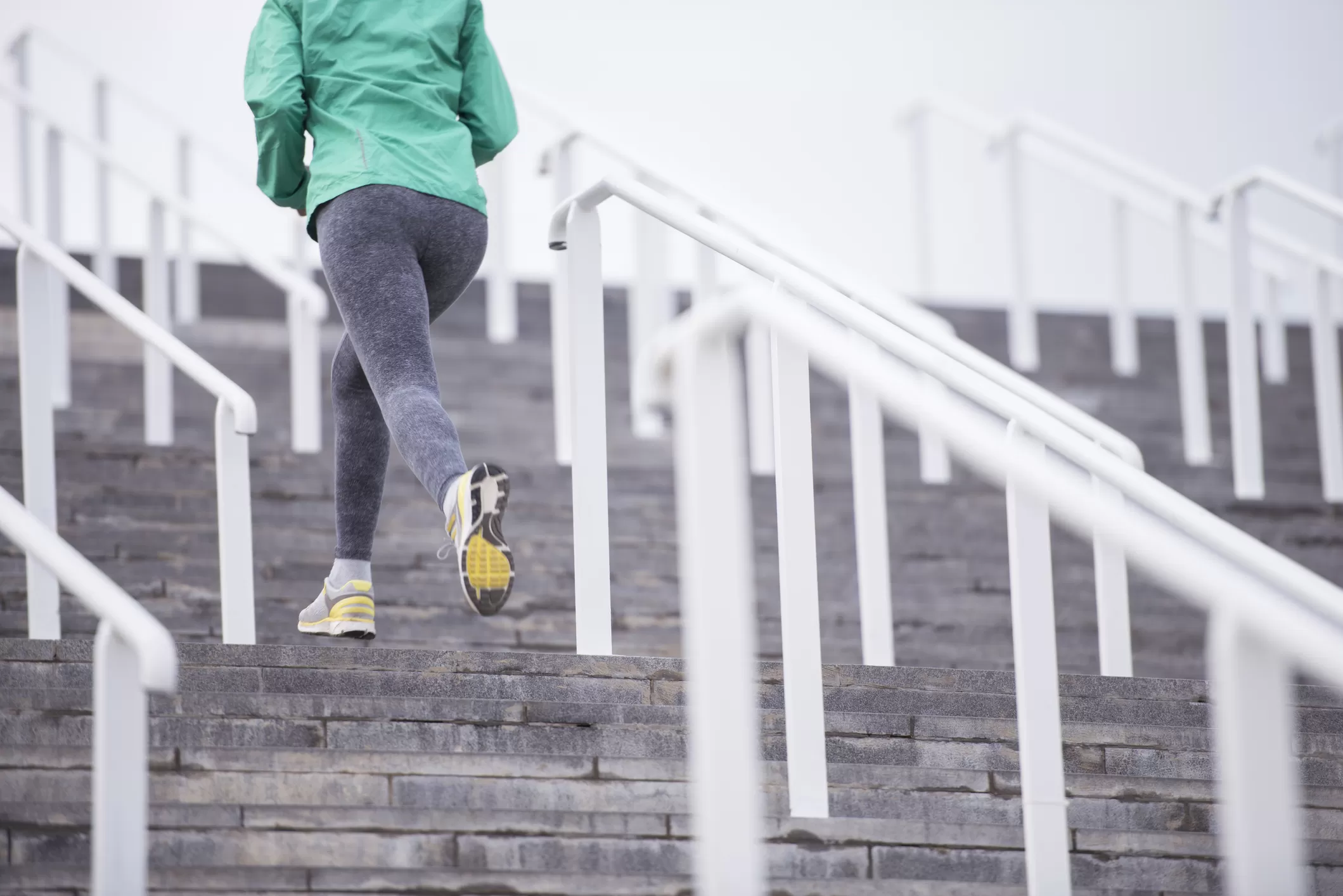 Woman running up stairs