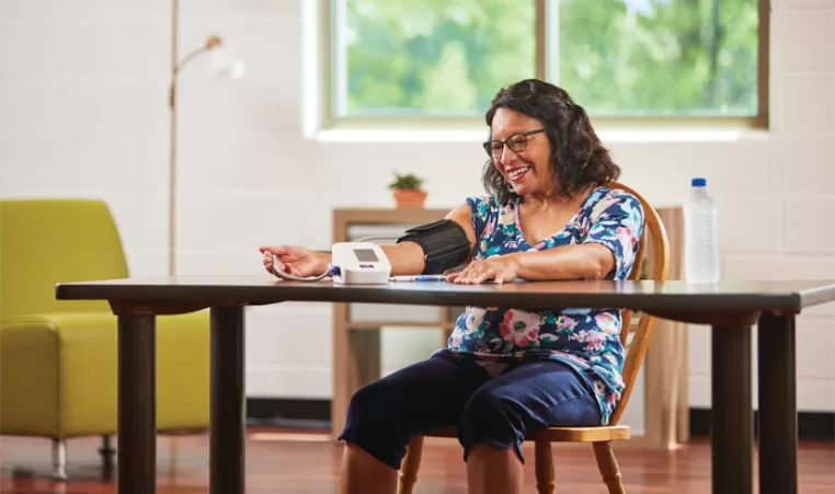 Woman checking her blood pressure