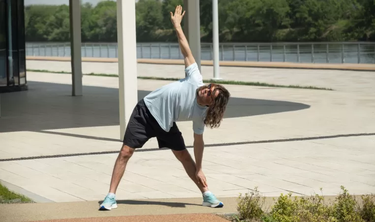 man doing a workout warm up outside