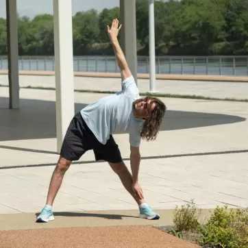 man doing a workout warm up outside