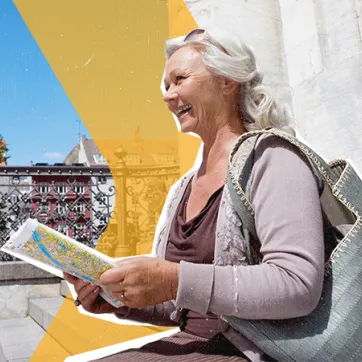 woman sitting on steps looking at a map