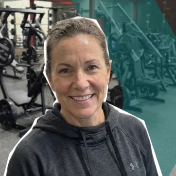 Woman smiling in the YMCA fitness center