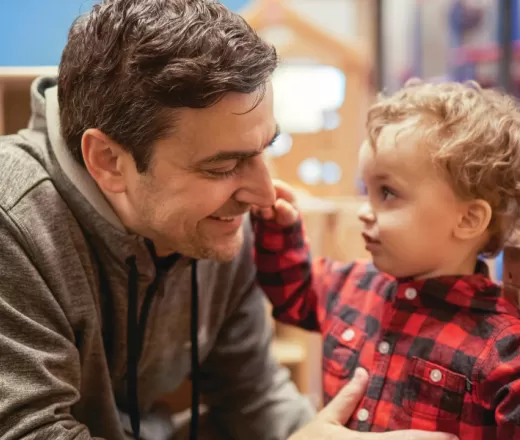 Father and child smiling
